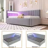 A modern bedroom with a grey upholstered bed featuring LED lighting and storage. The image is split into a main view and two detail views showing different configurations. Produktbild-Vorschau