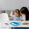 A mother and child are using a tablet together at a table. Produktbild-Vorschau