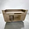 A reception desk with storage compartments and drawers, shown in a studio setting. Produktbild-Vorschau