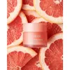 A small pink jar of LANEIGE Lip Sleeping Mask is placed in the center of the image, surrounded by slices of grapefruit. Produktbild-Vorschau