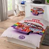 A bed set with a colorful VW bus design is shown on a bed. Produktbild-Vorschau