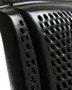 Close-up of a black perforated object, likely a gel pad for equestrian use. Produktbild-Vorschau