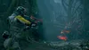 A person in a futuristic suit aims a weapon at a strange, glowing alien creature in a dark, overgrown forest. Produktbild-Vorschau