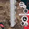 A close-up of a metal auger drill bit driven into the soil, with marketing icons and text on the right side. Produktbild-Vorschau