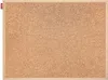 A close-up view of a cork bulletin board with a wooden frame. Produktbild-Vorschau