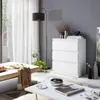 A modern living room scene featuring a white chest of drawers, a sofa, and a coffee table. Voir les images du produit