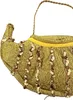 A close-up of a gold-colored handbag shaped like a magic lamp, decorated with sequins. Produktbild-Vorschau