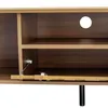 A close-up view of a modern TV stand with an open cabinet door and a cable management hole. Anteprima dell’immagine prodotto