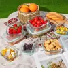A picnic setting with various food items in glass containers. Podgląd zdjęcia produktu