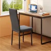 A chair is placed in front of a desk with a laptop and books, near a window with a view of trees. Voir les images du produit