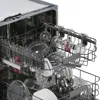 Inside view of a dishwasher rack filled with glassware and dishes. Produktbild-Vorschau