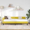 A yellow daybed with white bedding and pillows in a room with shelves on the wall. Podgląd zdjęcia produktu