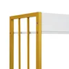 A close-up view of the corner of a white shelf unit with gold metal framing. Podgląd zdjęcia produktu