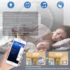 A woman and baby sleeping, with a smartphone and product features displayed. Voir les images du produit