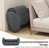 A dark gray floor chair is shown folded in a corner next to a beige sofa. A smaller inset image shows the floor chair unfolded. Produktbild-Vorschau