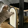 Two cats interacting with a multi-level cat tree that includes scratching surfaces and platforms. Náhľad obrázku produktu