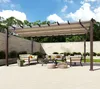 An outdoor patio area with a pergola, seating, and a coffee table. Podgląd zdjęcia produktu