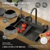 A kitchen sink with a faucet, tomatoes, and a cutting board on a wooden countertop. Produktbild-Vorschau