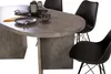 A close-up view of an oval dining table with chairs. Produktbild-Vorschau