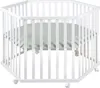A white hexagonal playpen with a green padded mat inside, shown from a slightly elevated angle. Náhled obrázku produktu