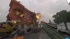 A scene of destruction with a building being demolished by an excavator, with explosions and debris. Produktbild-Vorschau