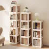 Three white bookshelves of varying heights are arranged in a room, filled with books and decorative items. Anteprima dell’immagine prodotto