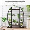 A multi-tiered plant stand filled with various potted plants, displayed on a wooden deck with a white slatted wall in the background. Náhľad obrázku produktu