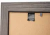 Close-up view of the back of a picture frame, showing hanging hardware. Náhled obrázku produktu
