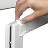 A hand is shown attaching a white plastic bracket to a white window frame. Produktbild-Vorschau