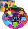 The image shows a dance playmat and its packaging. The packaging is in the background, and the playmat is in the foreground. The playmat has colorful stars and cartoon characters dancing on it. A green control unit is attached to the playmat. Náhled obrázku produktu