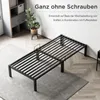 A metal bed frame is shown in a room with a rug and a shelf unit. Voir les images du produit