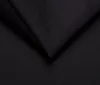 A close-up shot of black fabric, showing folds and texture. Produktbild-Vorschau