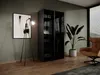 A modern bedroom or dressing room with a wardrobe, chair, plant, and artwork. Produktbild-Vorschau