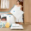 A woman is holding a vacuum-sealed bag in a closet with clothes and other vacuum-sealed bags. Voir les images du produit