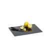 A cutting board with lemons and a knife on it. Náhled obrázku produktu