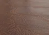A close-up, textured view of brown faux leather. Voir les images du produit