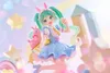 A figurine of Hatsune Miku dressed as a fairy tale character, with bunny ears and a blue dress, posed in a whimsical, pastel-colored setting with stars and hearts. Produktbild-Vorschau