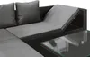 A close-up view of a section of a modular outdoor sofa with a glass-top coffee table. Náhled obrázku produktu