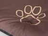 A close-up of a brown dog bed with a paw print design. Produktbild-Vorschau