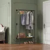 A hallway or entryway with a clothing rack, a chair, and a door. Produktbild-Vorschau