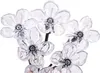 A close-up view of several clear, flower-shaped LED lights. Produktbild-Vorschau