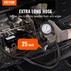 A hand wearing a glove is holding a compression tester near a car engine. Produktbild-Vorschau