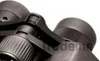 A close-up shot of the central hinge and focus wheels of a pair of black binoculars. Produktbild-Vorschau
