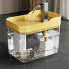 A pet drinking fountain with water flowing from a faucet into a yellow basin. Produktbild-Vorschau
