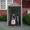 A portable storage tent for vehicles like scooters and bicycles, set up in a yard next to a house. Produktbild-Vorschau