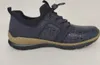 A side view of a blue sneaker with a tan sole. Voir les images du produit