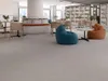 A modern lounge area with beanbag chairs and bookshelves. Produktbild-Vorschau