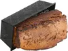 A loaf of bread is shown inside a black perforated bread pan. Podgląd zdjęcia produktu