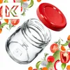 A clear glass jar with a red lid, surrounded by various fresh vegetables and herbs. Podgląd zdjęcia produktu