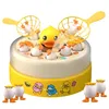 A yellow and white interactive duck catching game for children, with small duck figures around the base. Náhľad obrázku produktu